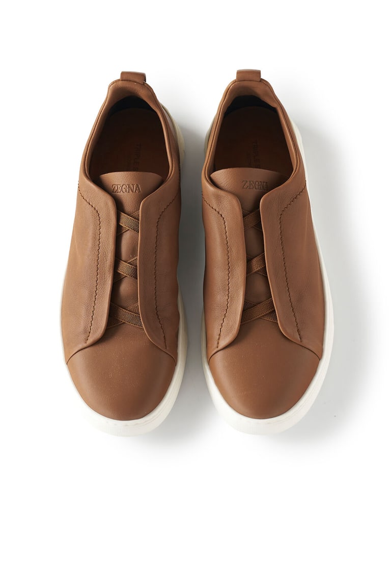 Zegna | Triple Stitch leather sneakers size 10 UK 11 US, stamped S5207Z: Zegna | Triple Stitch leather sneakers size 10 UK 11 US, stamped S5207Z in brown deer leather, white rubber sole, new, unworn condition For further information on this lot please visit Bonhams.com For