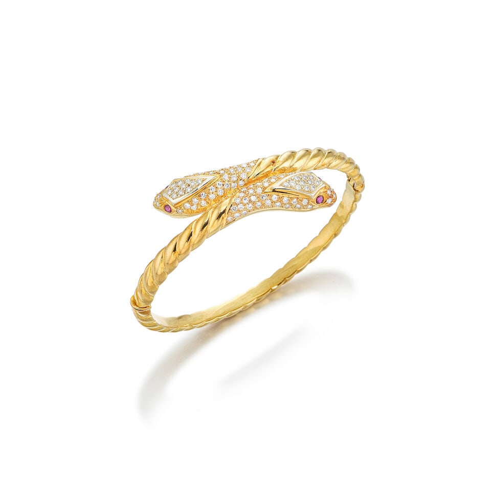 GEM-SET AND DIAMOND BANGLE: GEM-SET AND DIAMOND BANGLE 彩色寶石配鑽石手鐲 Metal: 18 karat yellow gold Inner circumference: 16.0cm Inner diameters: 5.5 x 4.8cm Gross weight: 2