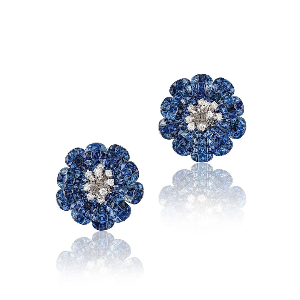 PAIR OF SAPPHIRE AND DIAMOND 'FLOWER' EARRINGS: PAIR OF SAPPHIRE AND DIAMOND 'FLOWER' EARRINGS 藍寶石配鑽石耳環 Metal: 18 karat white gold Dimensions: 2.5 x 2.4cm Gross weight: 21.8g For further