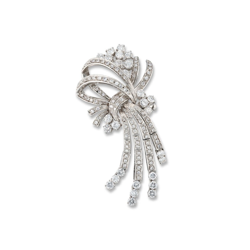 DIAMOND BROOCH: DIAMOND BROOCH 鑽石別針 Metal: 18 karat white gold Length: 6.3cm Gross weight: 18.0g one diamond deficient For further information on this lot please visit Bonhams.com For