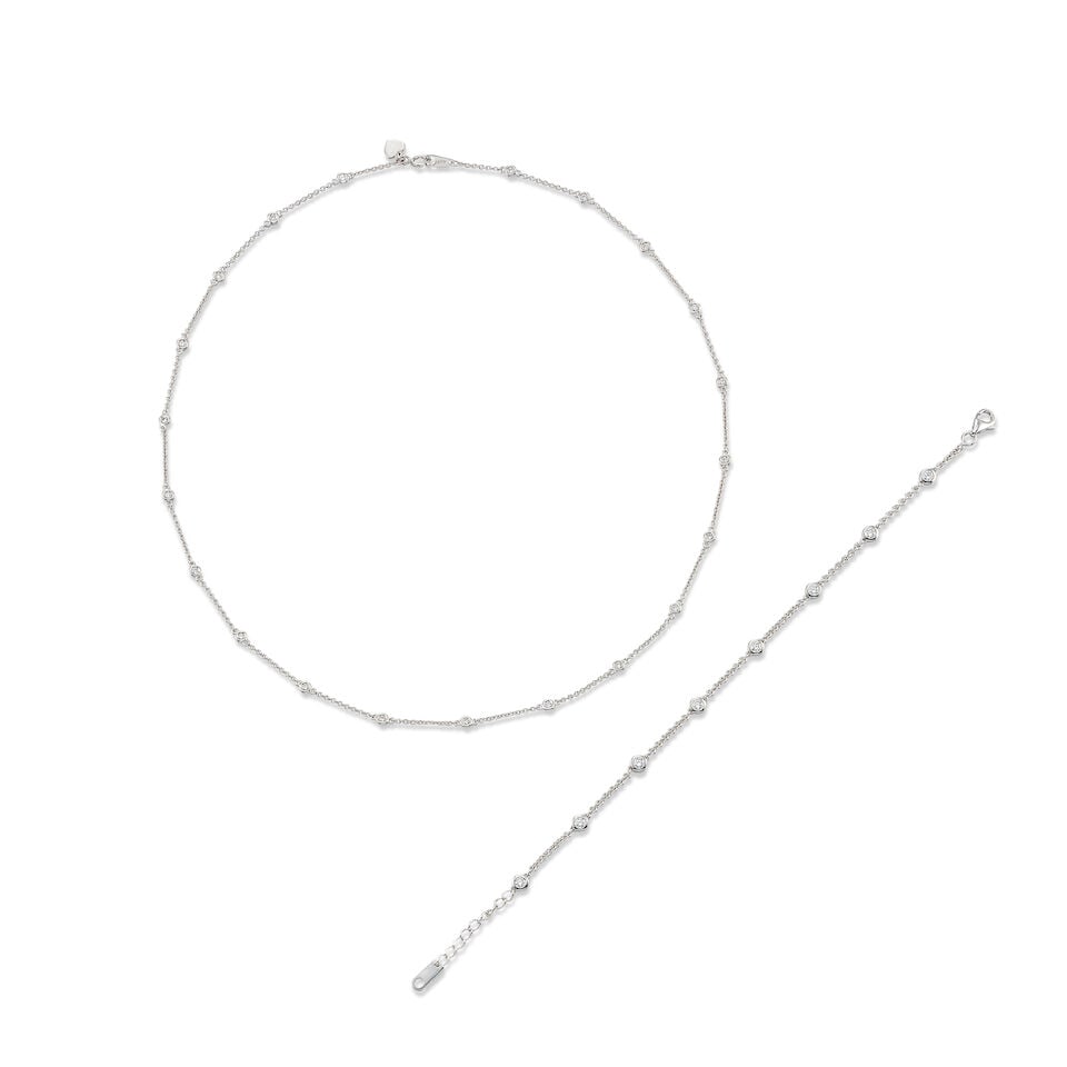 DIAMOND NECKLACE AND BRACELET SET: DIAMOND NECKLACE AND BRACELET SET 鑽石項鍊及手鍊套裝 Metal: platinum and 18 karat white gold Length: necklace 40.0cm; bracelet 17.5cm Gross