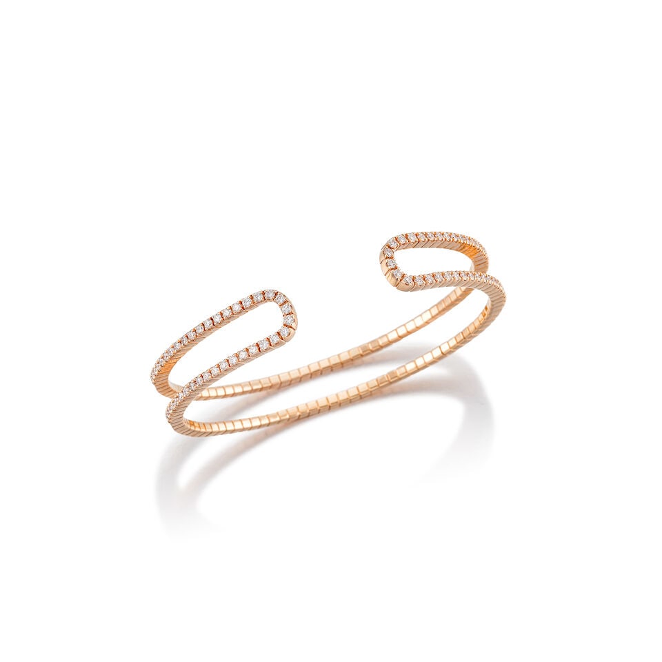 DIAMOND BANGLE: DIAMOND BANGLE 鑽石手鐲 Metal: 18 karat pink gold Inner circumference: 14.7cm (expandable) Inner diameter: 5.2 x 4.0cm Gross weight: 15.7g For further information on this lot