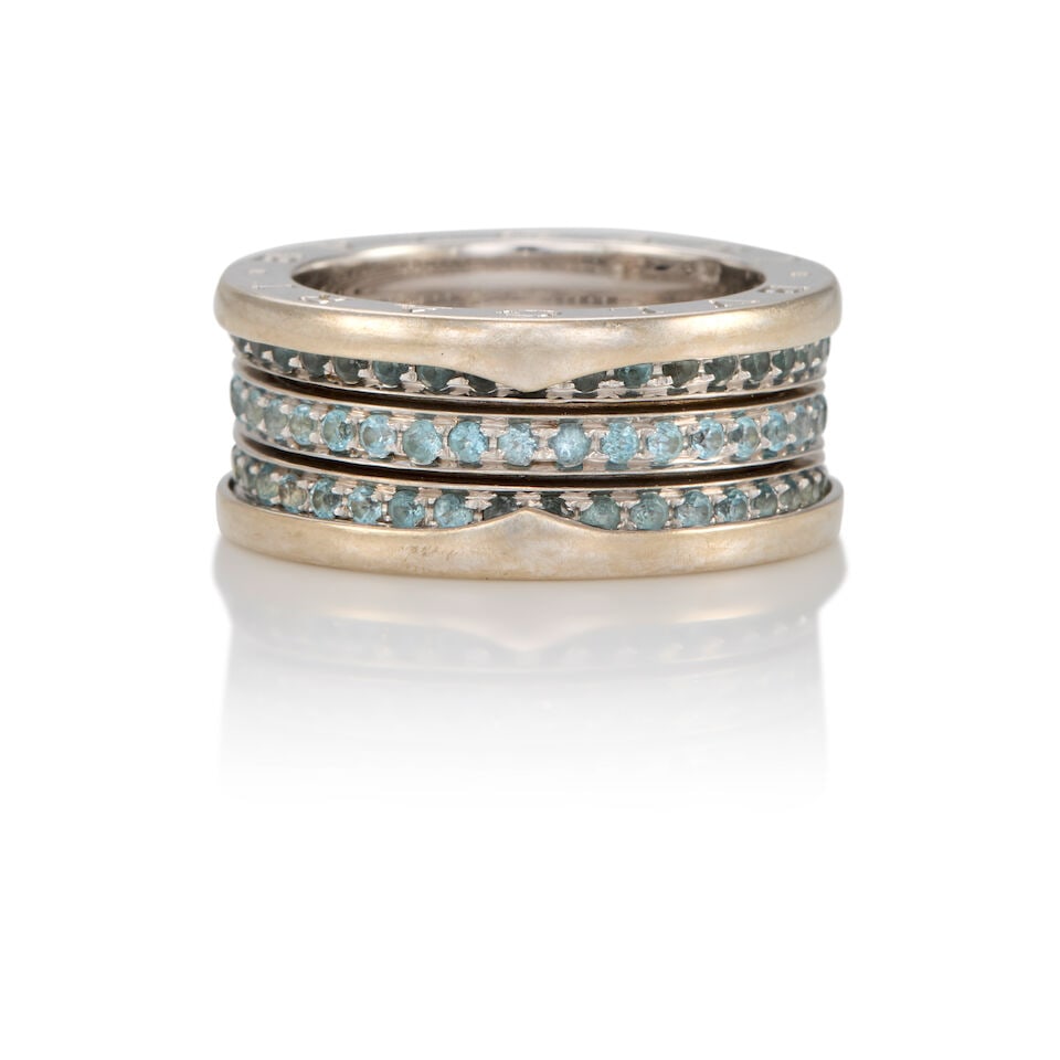BULGARI: 18K WHITE GOLD AND TOPAZ RING: BULGARI: 18K WHITE GOLD AND TOPAZ RING • 18k white gold • Numerous round topazes measuring approximately 1.50mm in diameter • Signed BVLGARI • Size 7 3/4 • Estimated gros