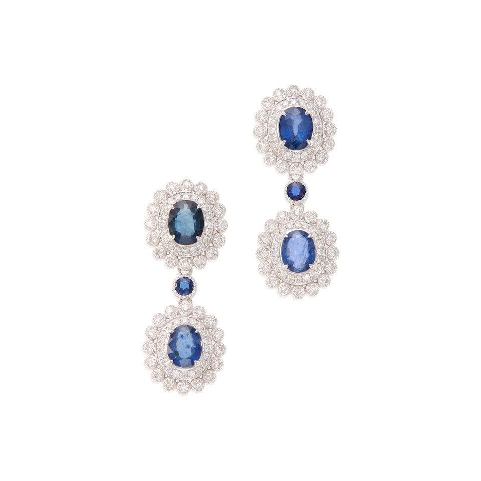 PAIR OF PLATINUM, SAPPHIRE AND DIAMOND EARRINGS: PAIR OF PLATINUM, SAPPHIRE AND DIAMOND EARRINGS • Platinum • Numerous round diamonds weighing approximately 0.80 - 0.90 carat total • 6 round and oval sapphires weighing