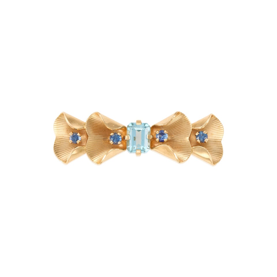 TIFFANY & CO.: 14K GOLD, AQUAMARINE, AND SAPPHIRE RETRO BROOCH: TIFFANY & CO.: 14K GOLD, AQUAMARINE, AND SAPPHIRE RETRO BROOCH • 14K yellow gold • One rectangular shaped aquamarine measuring approximately 1.20 carats • Four round shaped