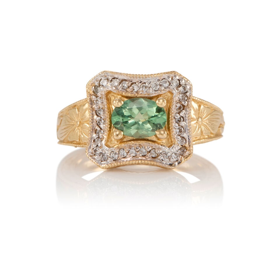14K GOLD, SAPPHIRE, AND DIAMOND RING: 14K GOLD, SAPPHIRE, AND DIAMOND RING • 14K yellow gold • One oval shaped sapphire weighing approximately 1 carat total • Numerous round shaped diamonds weighing approximately 0.20
