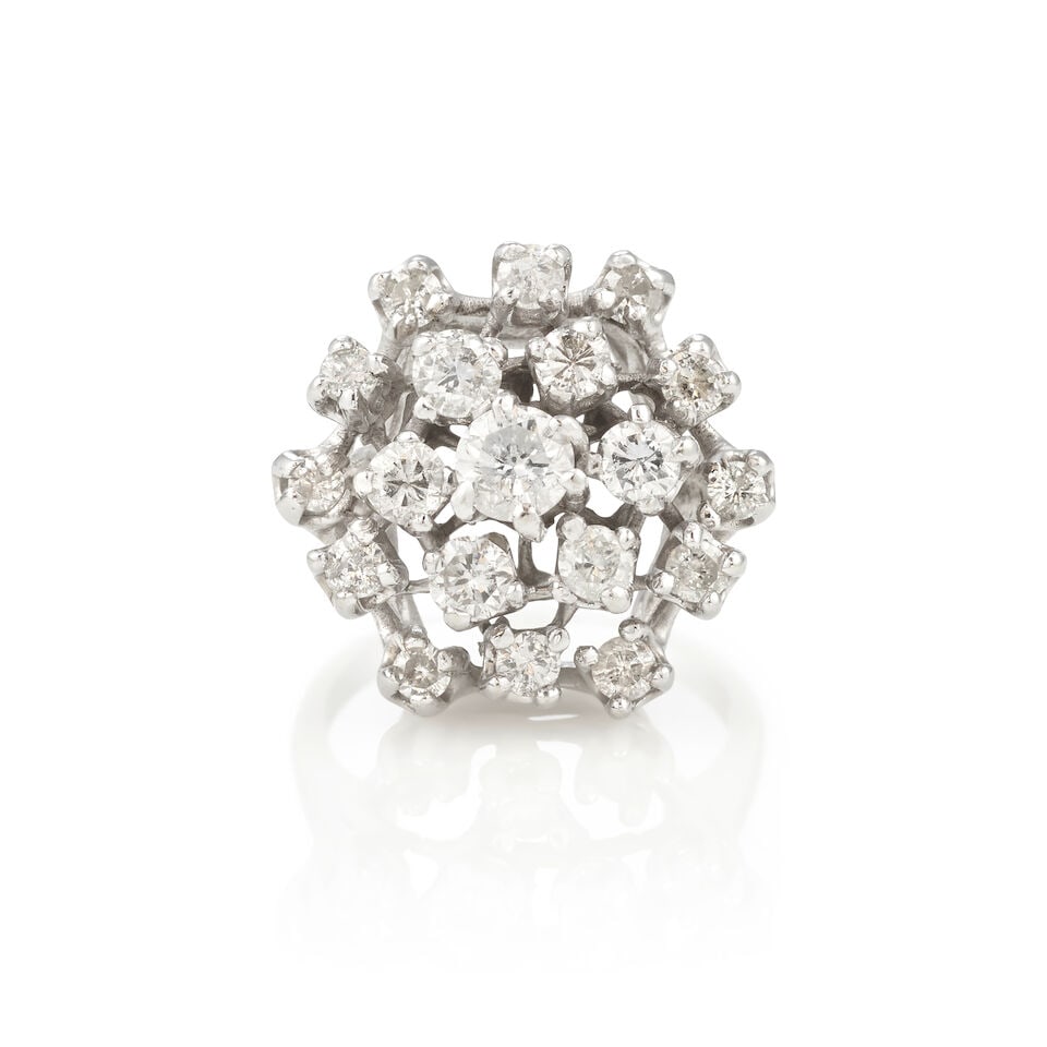 12K GOLD AND DIAMOND RING: 12K GOLD AND DIAMOND RING • 12K white gold • 19 round diamonds weighting approximately 1.35 - 1.55 carats total • Size 6 • Estimated gross weight: 8.4 grams Footnotes: Overall