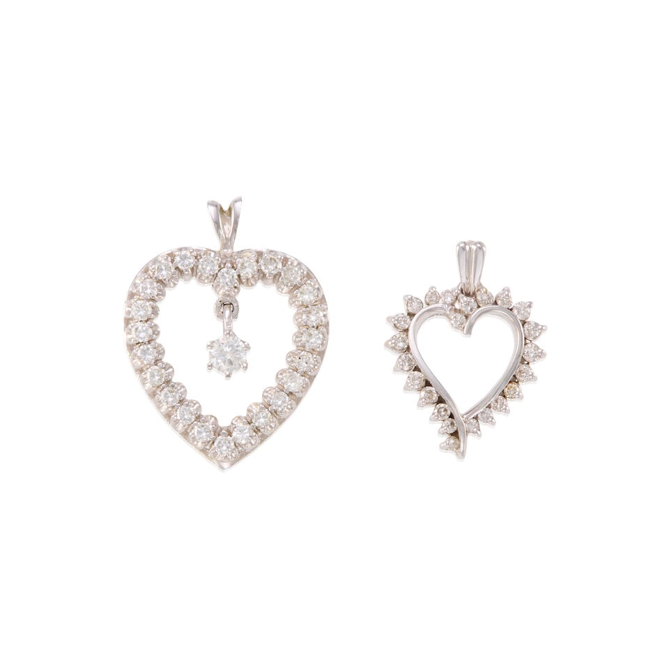 TWO GOLD AND DIAMOND HEART PENDANTS: TWO GOLD AND DIAMOND HEART PENDANTS • One heart pendant of 14k white gold with numerous round diamonds weighing approximately 0.35 - 0.45 carat total, measures 3/4 x 11/16 in. • One heart
