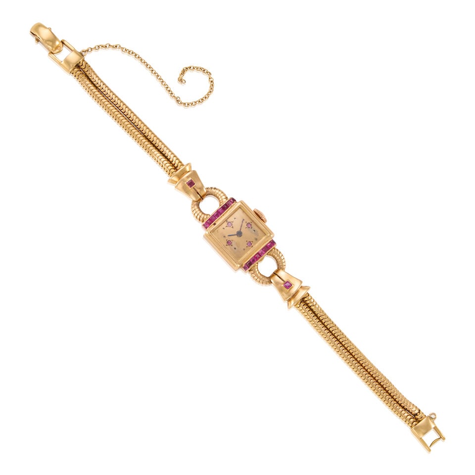 RETRO 18K GOLD AND RUBY WRISTWATCH: RETRO 18K GOLD AND RUBY WRISTWATCH • 18k yellow gold • Numerous square-cut rubies weighing approximately 0.80 - 0.90 carat total • Mechanical movement running but accurate