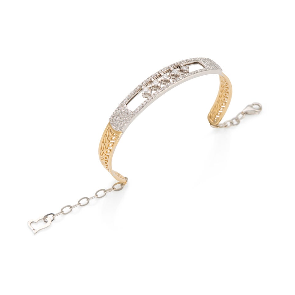 14K BICOLOR GOLD AND DIAMOND SLIDE BRACELET: 14K BICOLOR GOLD AND DIAMOND SLIDE BRACELET • 14k yellow and white gold • Numerous round diamonds weighing approximately 1.25 - 1.35 carat total • 5 sliding round diamond elements we
