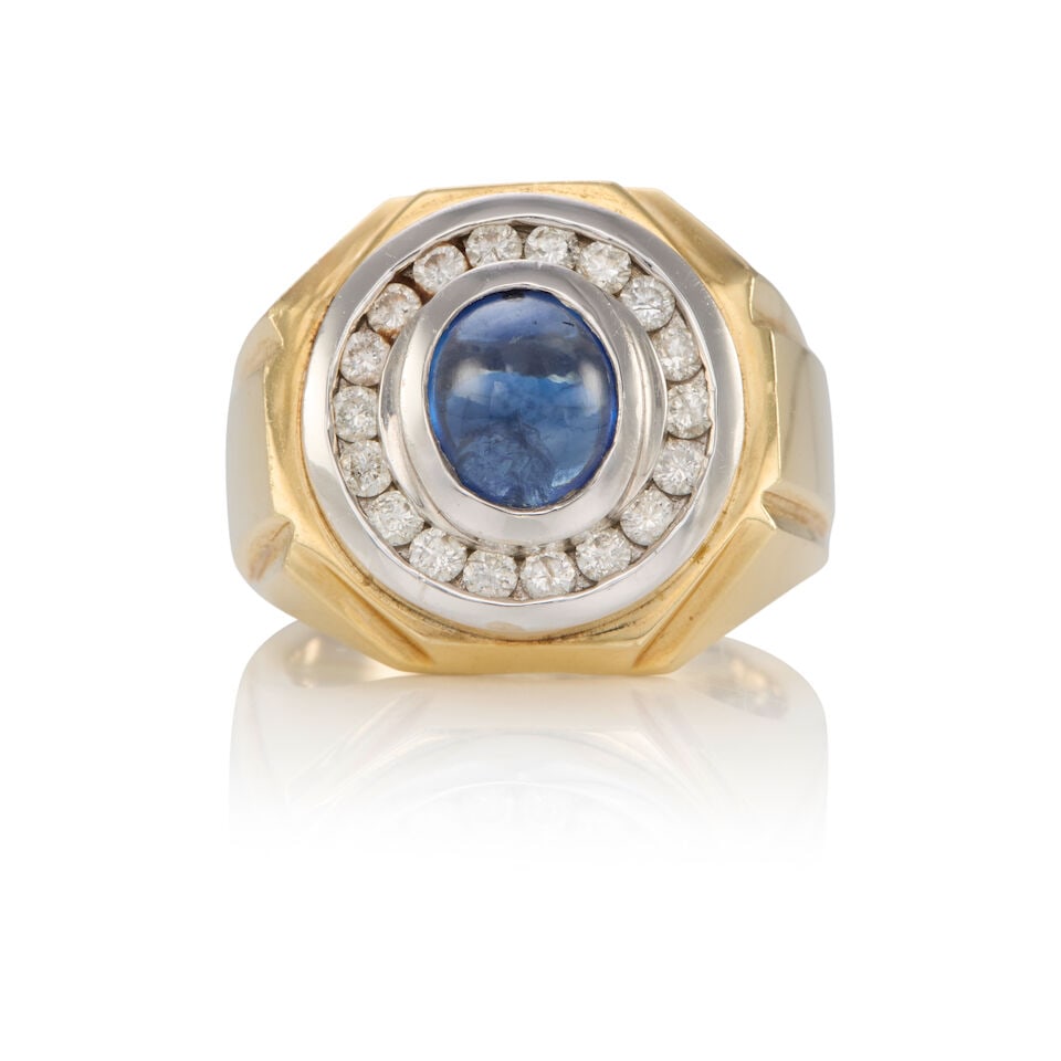 14K BICOLOR GOLD, DIAMOND AND SAPPHIRE RING: 14K BICOLOR GOLD, DIAMOND AND SAPPHIRE RING • 14k yellow and white gold • Numerous round diamonds weighing approximately 1.00 - 1.10 carat total • 1 oval cabochon sapphire weighing