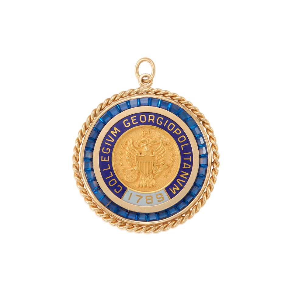 14K GOLD MEDALLION PENDANT: 14K GOLD MEDALLION PENDANT • 14k yellow gold • Numerous near square blue stone accents • Light and dark blue enamel • Large personal inscription on the back of the pendant