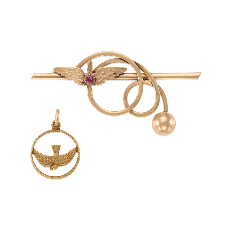 GROUP OF 10K GOLD JEWELRY: GROUP OF 10K GOLD JEWELRY • One charm/pendant of 10k yellow gold, maker's mark, measures 5/8 x 5/8 in. • One brooch of 10k yellow gold with 1 round ruby measuring approximately 2.4mm,