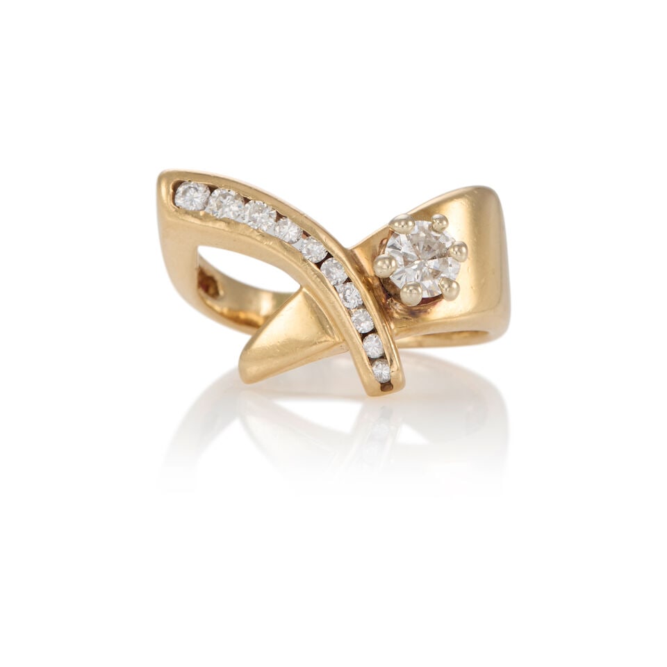 14K GOLD AND DIAMOND RING: 14K GOLD AND DIAMOND RING • 14k yellow gold • 10 round diamonds weighing approximately 0.10 - 0.20 carat total • 1 round diamond weighing approximately 0.30 - 0.40 carat