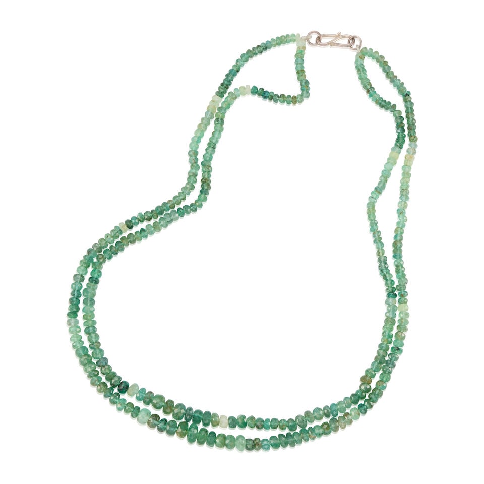 SILVER AND EMERALD BEAD NECKLACE: SILVER AND EMERALD BEAD NECKLACE • Silver clasp • Numerous graduated facetted emerald beads measuring approximately 4.02mm - 7.10mm in diameter • Length 18 3/4 in. • Estimated