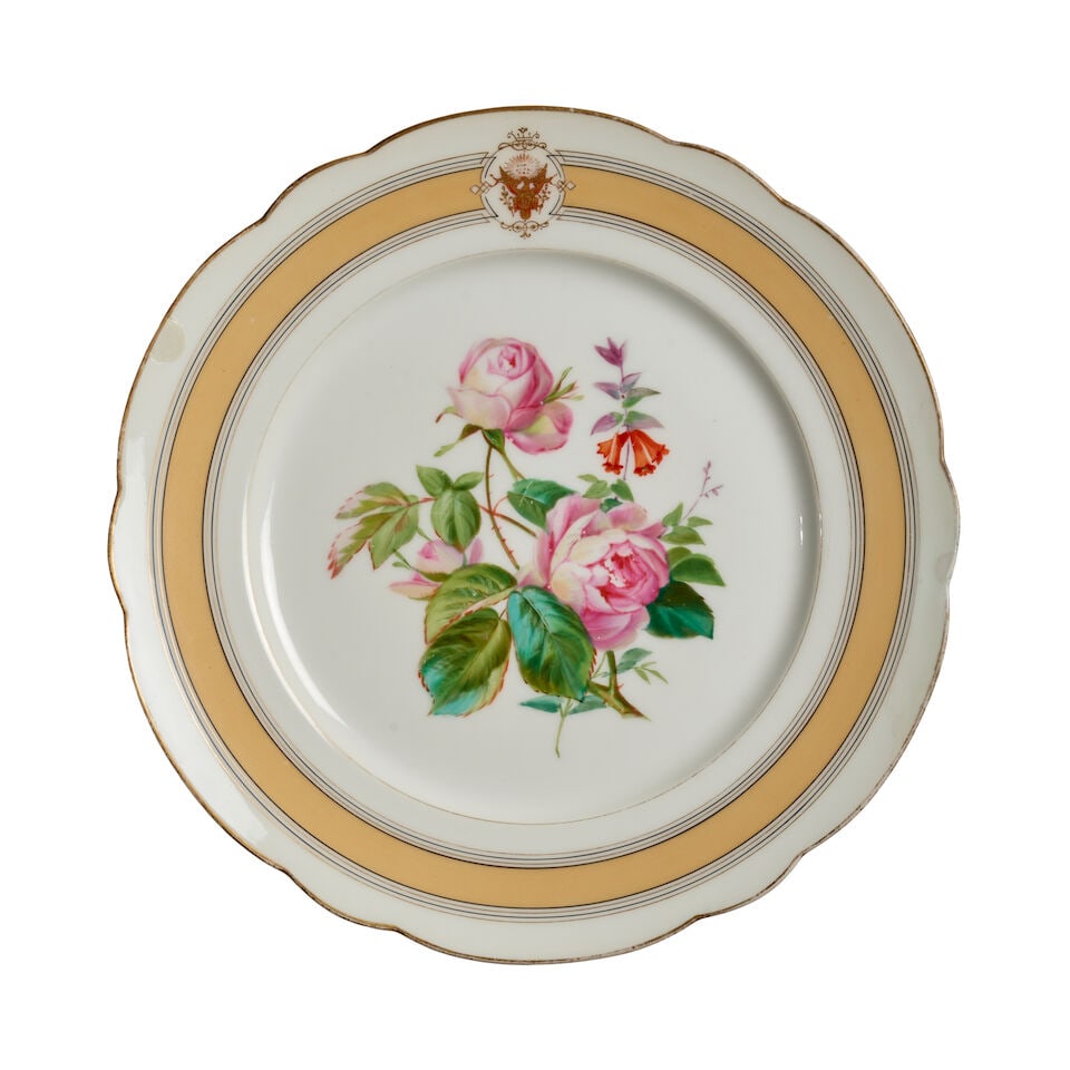 A Ulysses S. Grant Presidential Service Dinner Plate.: A Ulysses S. Grant Presidential Service Dinner Plate. A porcelain plate with gilt rim, cream, gilt and black lined border, hand-painted Great Seal of the United States in red and gold on border, and