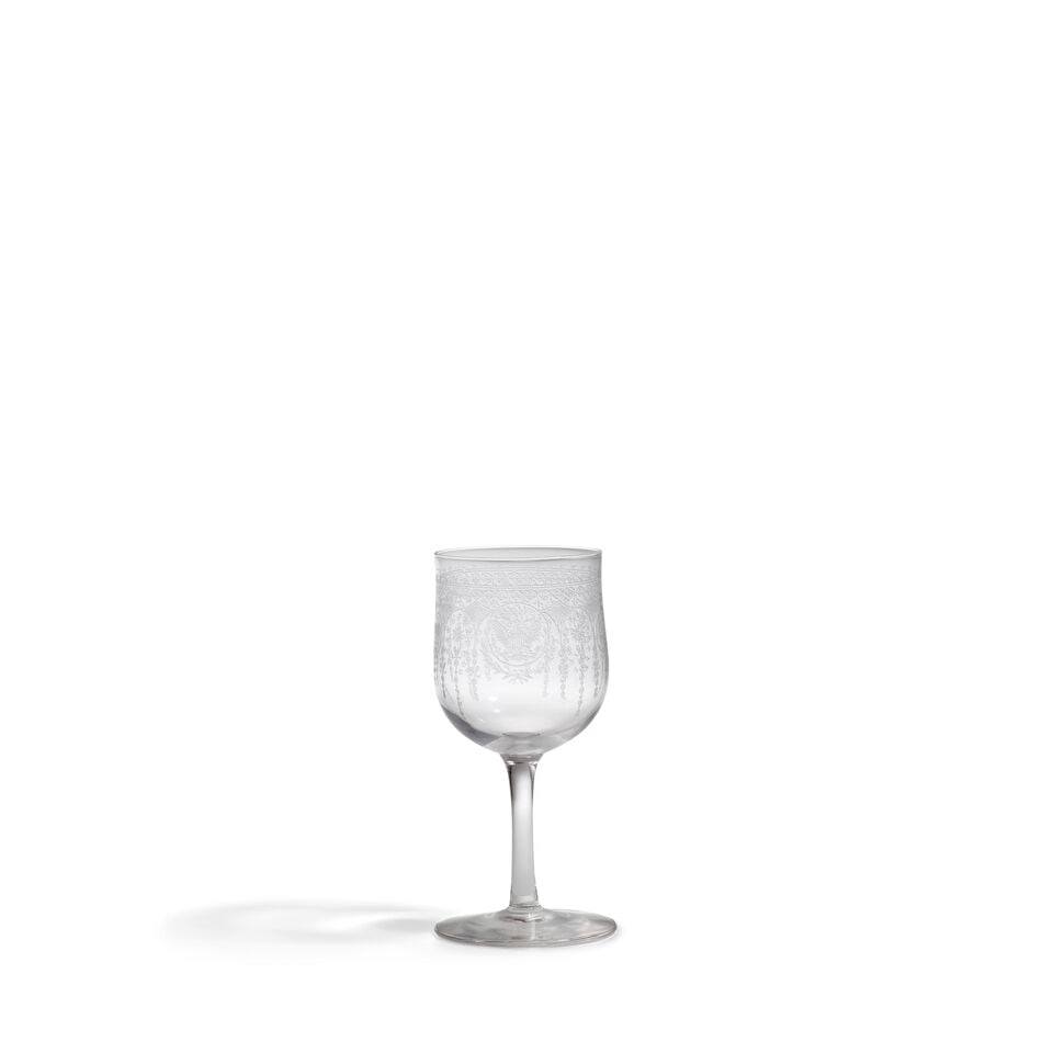 A Theodore Roosevelt White House Wine Glass from the 1902 State Service. Albany: Van Heusen Char...: A Theodore Roosevelt White House Wine Glass from the 1902 State Service. Albany: Van Heusen Charles Company, 1902. Etched glass, produced for use with President Theodore Roosevelt's 1902 White House