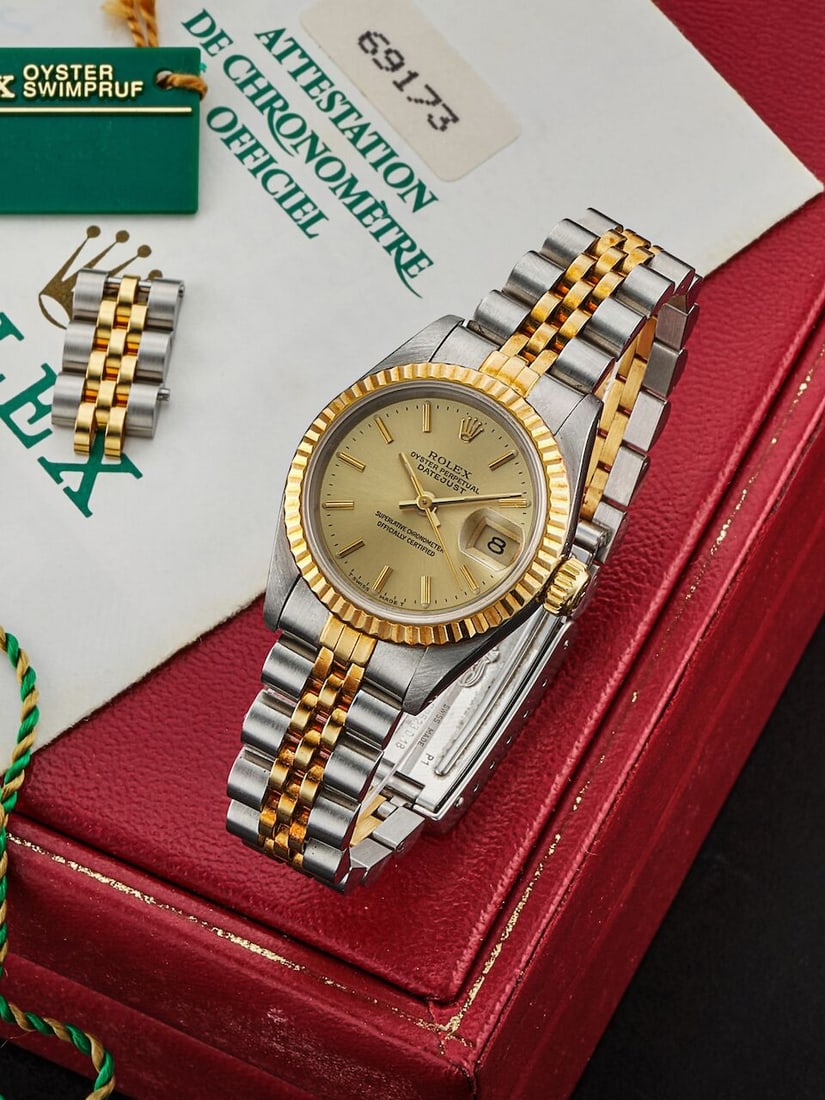 ROLEX | DATEJUST, REF.69173, A YELLOW GOLD AND STAINLESS STEEL BRACELET WATCH WITH DATE, CIRCA 1991: ROLEX | DATEJUST, REF.69173, A YELLOW GOLD AND STAINLESS STEEL BRACELET WATCH WITH DATE, CIRCA 1991 Case No: E683095 Calibre: 2135, automatic, signed Dial: Champagne, signed Case: 26mm, 18k yellow gol