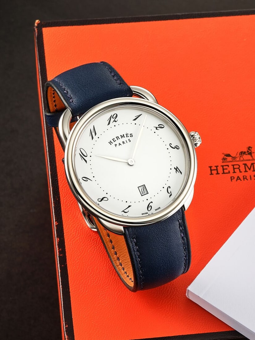 [NO RESERVE] HERMÈS | ARCEAU, REF.AR7Q.810, A BRAND NEW STAINLESS STEEL WRISTWATCH, CIRCA 2024: [NO RESERVE] HERMÈS | ARCEAU, REF.AR7Q.810, A BRAND NEW STAINLESS STEEL WRISTWATCH, CIRCA 2024 Case No: 3739441 Calibre: Quartz, signed Dial: White, signed Case: 36mm, stainless steel, screwed ca