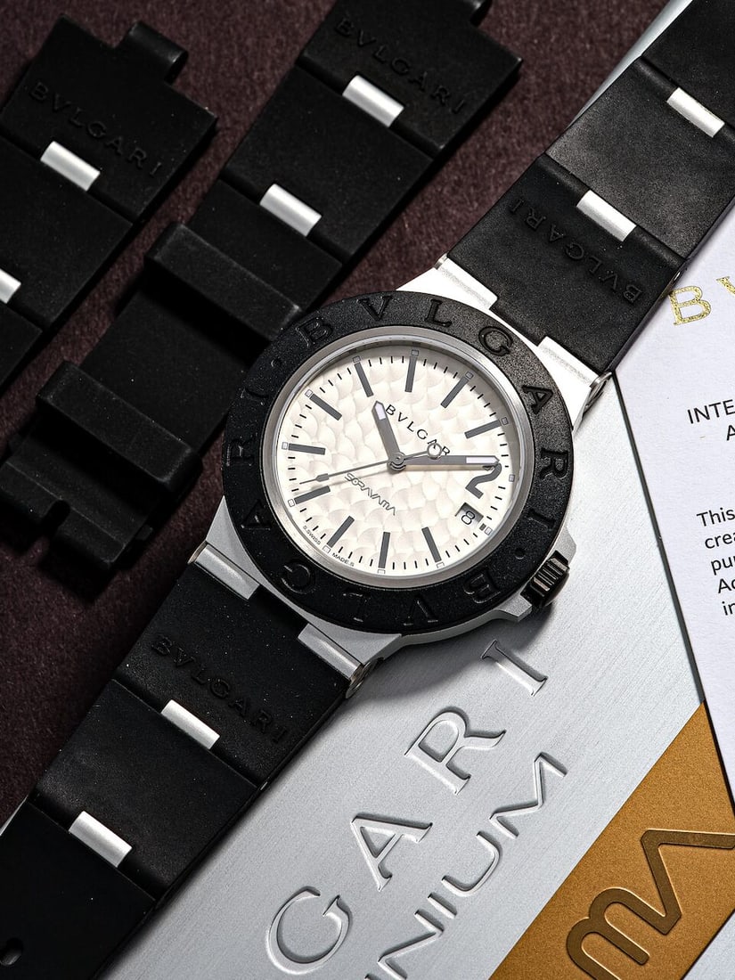 BVLGARI | SORAYAMA, REF.103703, A LIMITED EDITION ALUMINIUM AND DLC-COATED TITANIUM WRISTWATCH W...: BVLGARI | SORAYAMA, REF.103703, A LIMITED EDITION ALUMINIUM AND DLC-COATED TITANIUM WRISTWATCH WITH DATE, CIRCA 2022 Case No: BU32BIR, Limited to 1000 Calibre: ETA 1892, automatic, signed Dial: Silver