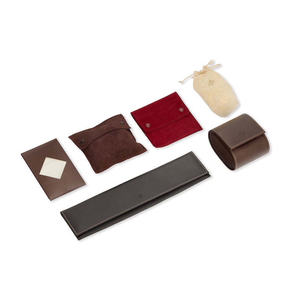 Patek Philippe. A lot of accessories (6) Various dates: Patek Philippe. A lot of accessories (6) Comprising of: A brown leather case A brown leather service case A brown suede leather pouch A red suede leather pouch A white velvet pouch Polishing