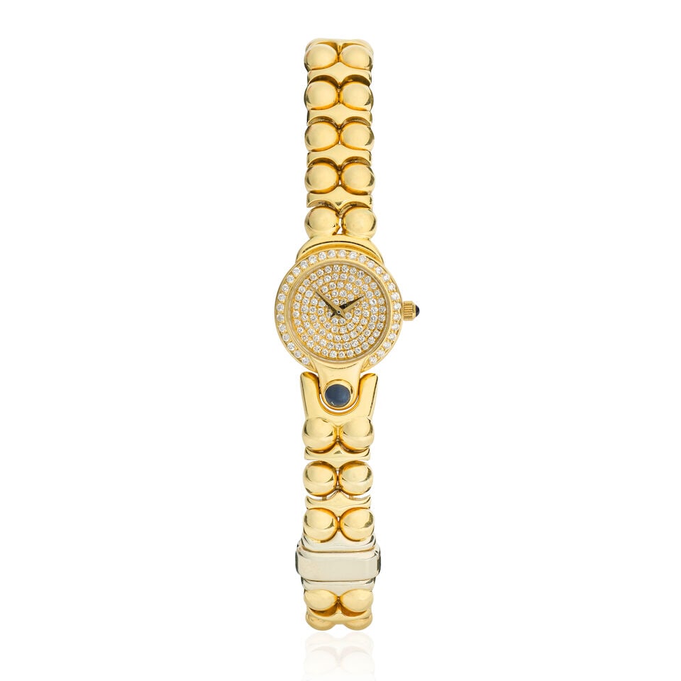 Signoretti. A lady's 18K gold diamond-set quartz bracelet watch London hallmark for 1999: Signoretti. A lady's 18K gold diamond-set quartz bracelet watch Date: London hallmark for 1999 Movement: 6-jewel ETA quartz Dial: Pave-set brilliant-cut diamond Case: Brushed and polished round, diamo