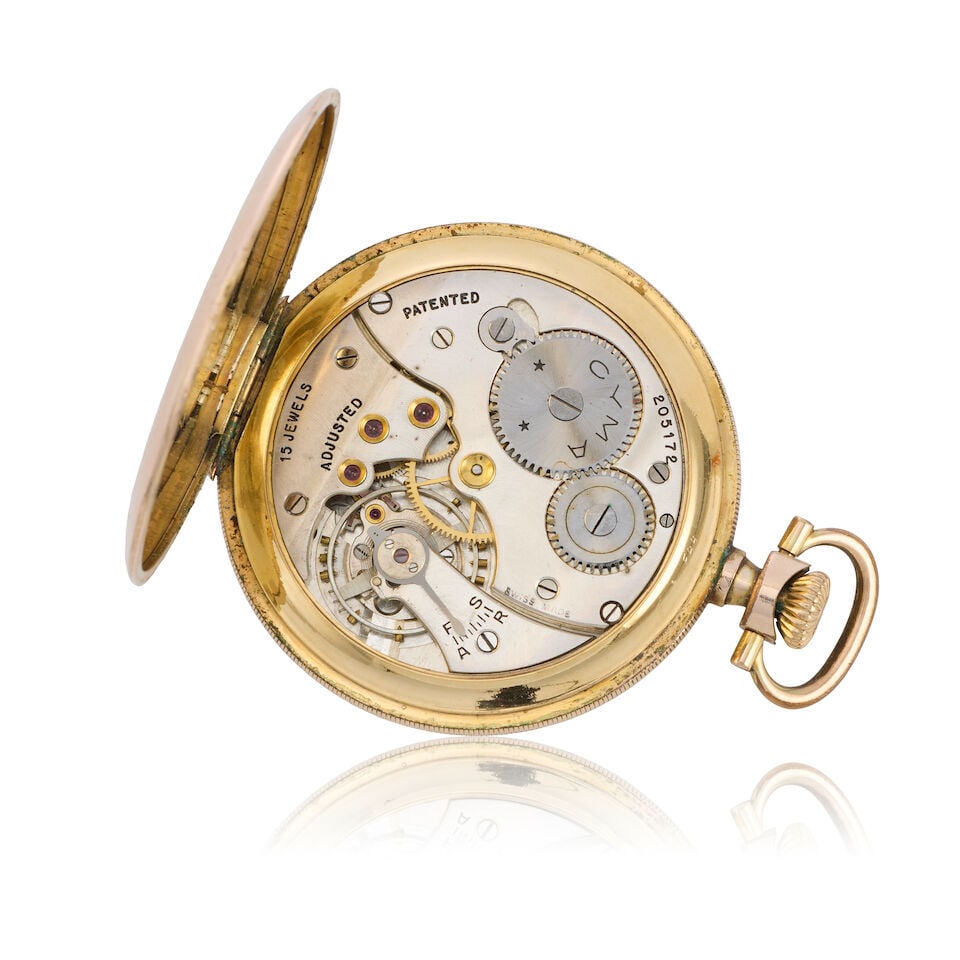 Cyma. A gold plated keyless wind open face pocket watch with a 9K gold chain Circa 1920 - 2