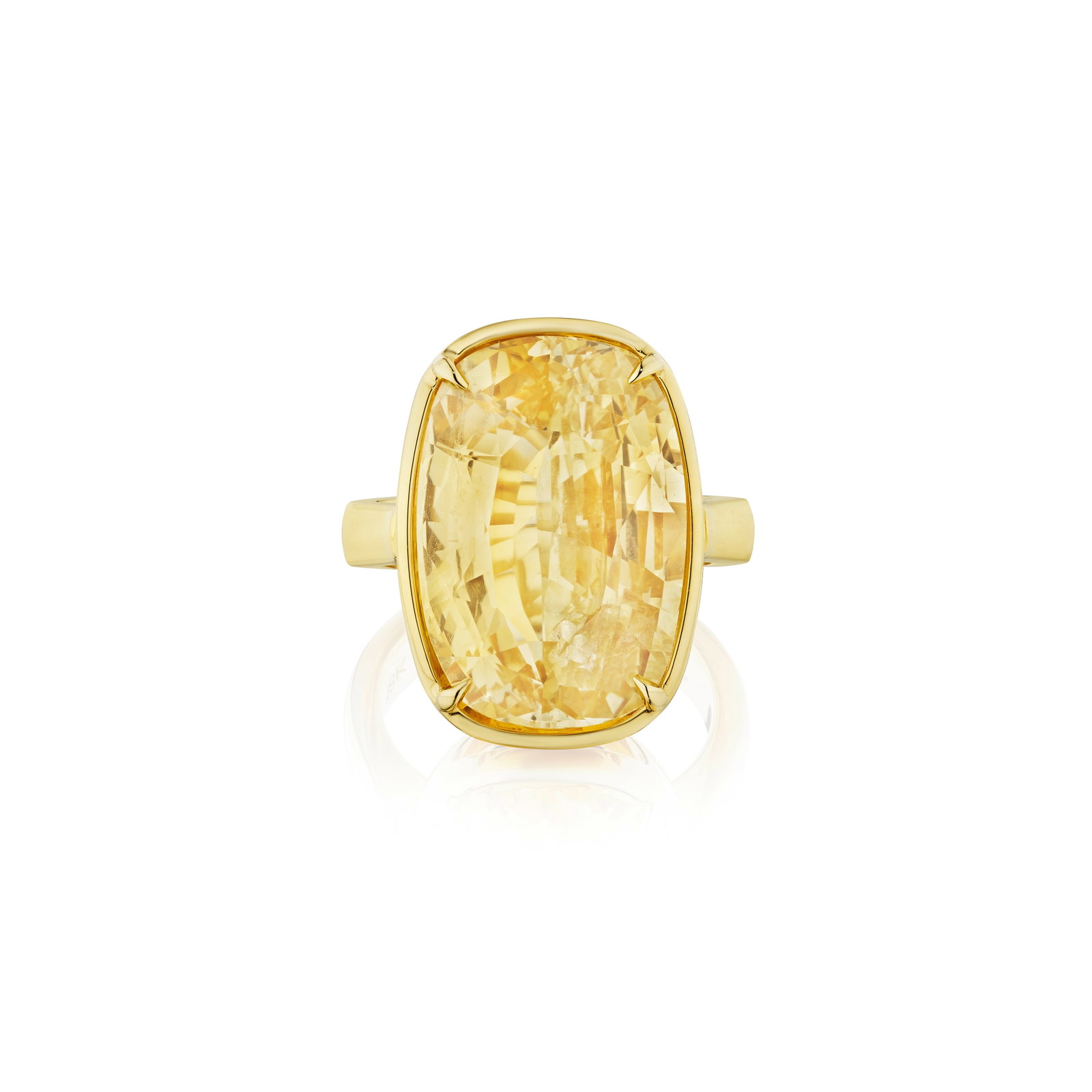 A YELLOW SAPHIRE RING: A YELLOW SAPHIRE RING Centering a cushion-shaped yellow sapphire, weighing 18.81 carats; mounted in 18K gold; size 6¼ Footnotes: Accompanied by GIA report stating that the yellow sapphire is of
