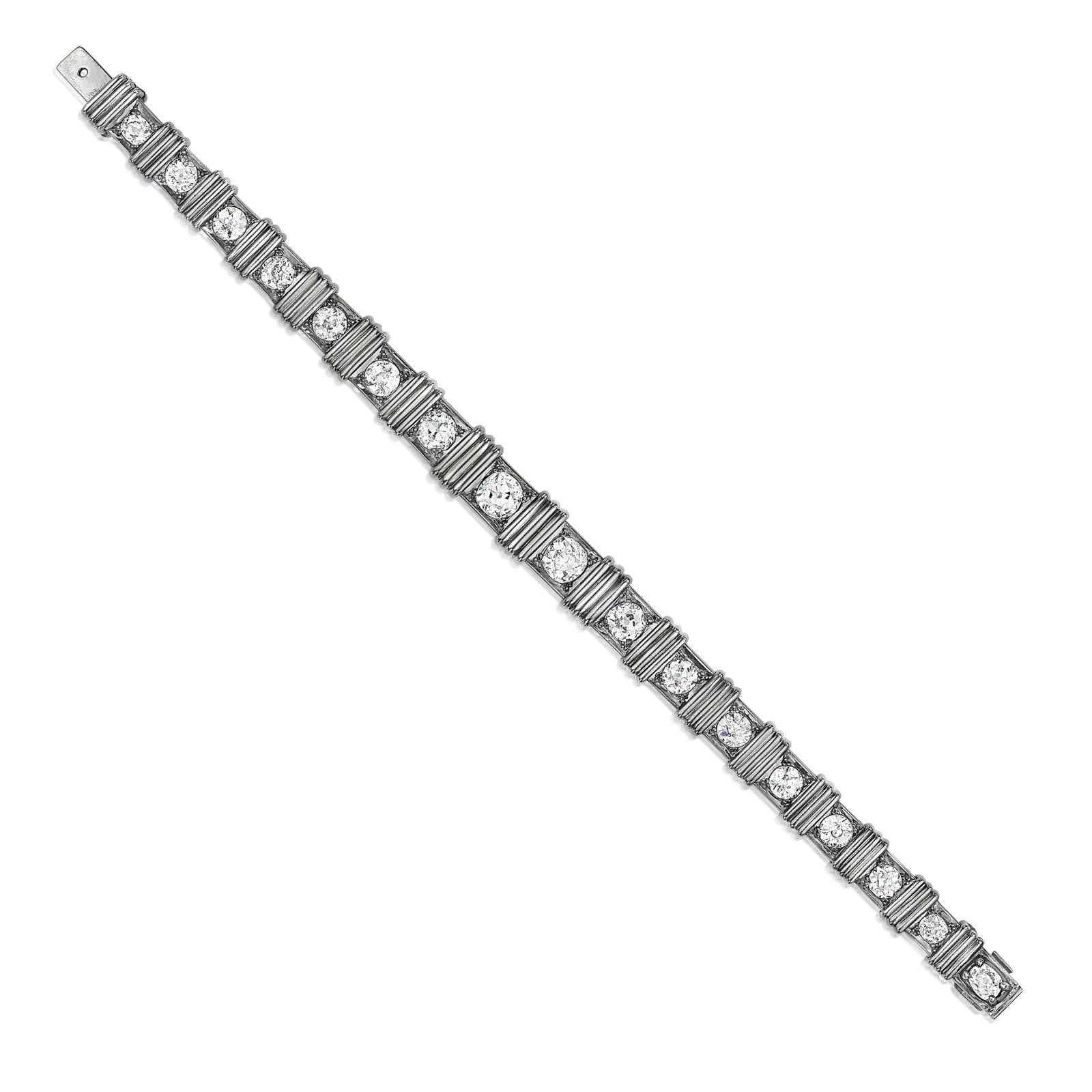 A DIAMOND BRACELET: A DIAMOND BRACELET Designed as a row of graduated old European-cut diamonds within a geometric blackened frame; estimated total diamond weight 8.20 carats; mounted in blackened platinum; length