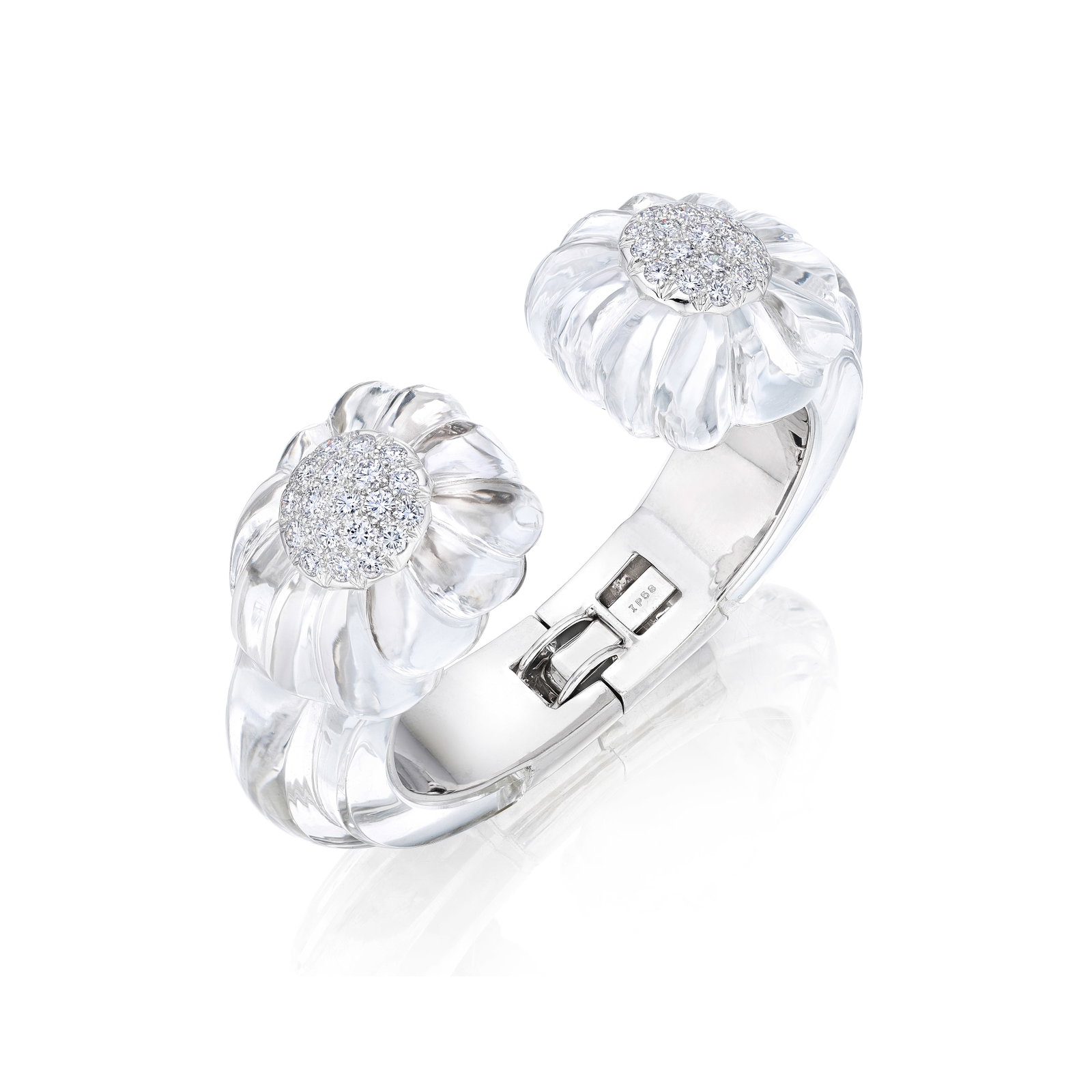 DAVID WEBB: A ROCK CRYSTAL AND DIAMOND CUFF: DAVID WEBB: A ROCK CRYSTAL AND DIAMOND CUFF Designed as a hinged bangle of carved rock crystal, accented by clusters of round brilliant-cut diamonds on the terminals; signed DAVID WEBB; estimated
