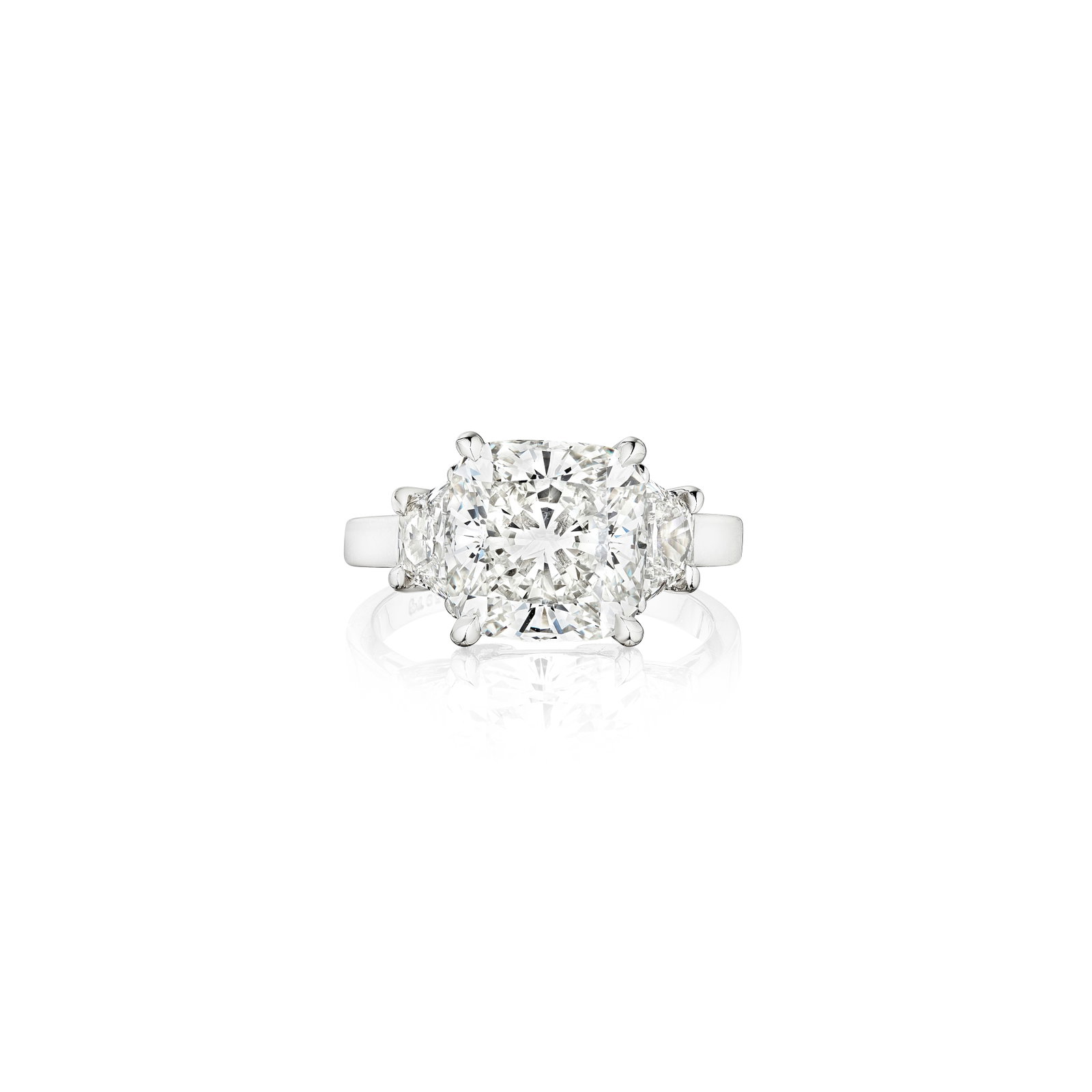 A DIAMOND RING: A DIAMOND RING Centering a cushion-cut diamond, weighing 4.01 carats, flanked by two trapezoid-shaped diamonds; mounted in platinum; size 4¾ Footnotes: Accompanied by GIA report stating that the 