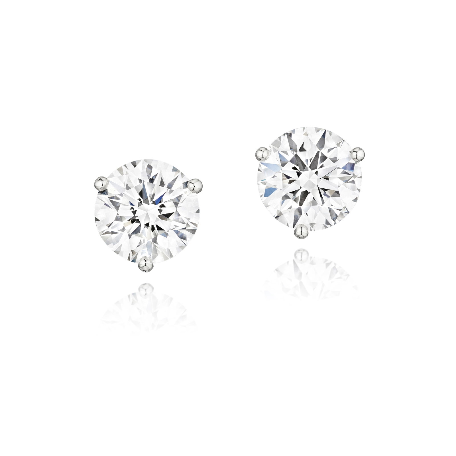 TIFFANY & CO: A PAIR OF DIAMOND EARRINGS: TIFFANY & CO: A PAIR OF DIAMOND EARRINGS Each centering a round brilliant-cut diamond, weighing 2.74 and 2.76 carats respectively; signed T&CO.; mounted in platinum; length ⅜ in; accompanied by