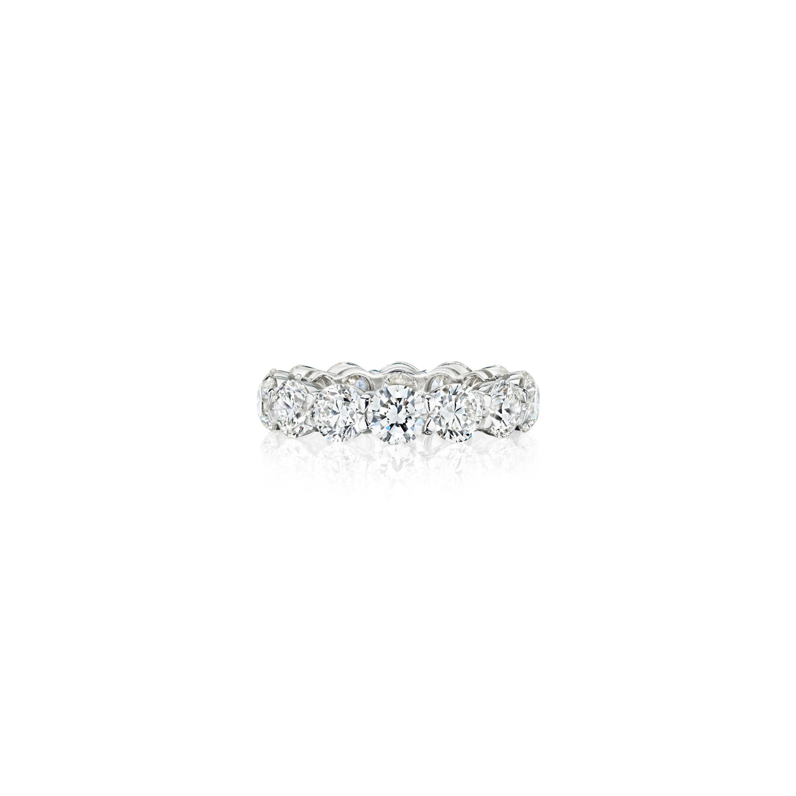 A DIAMOND BAND: A DIAMOND BAND Designed as a row of round brilliant-cut diamonds, weighing 7.01 carats total; mounted in 18K white gold; size 7 Footnotes: Accompanied by fourteen GIA reports stating that the