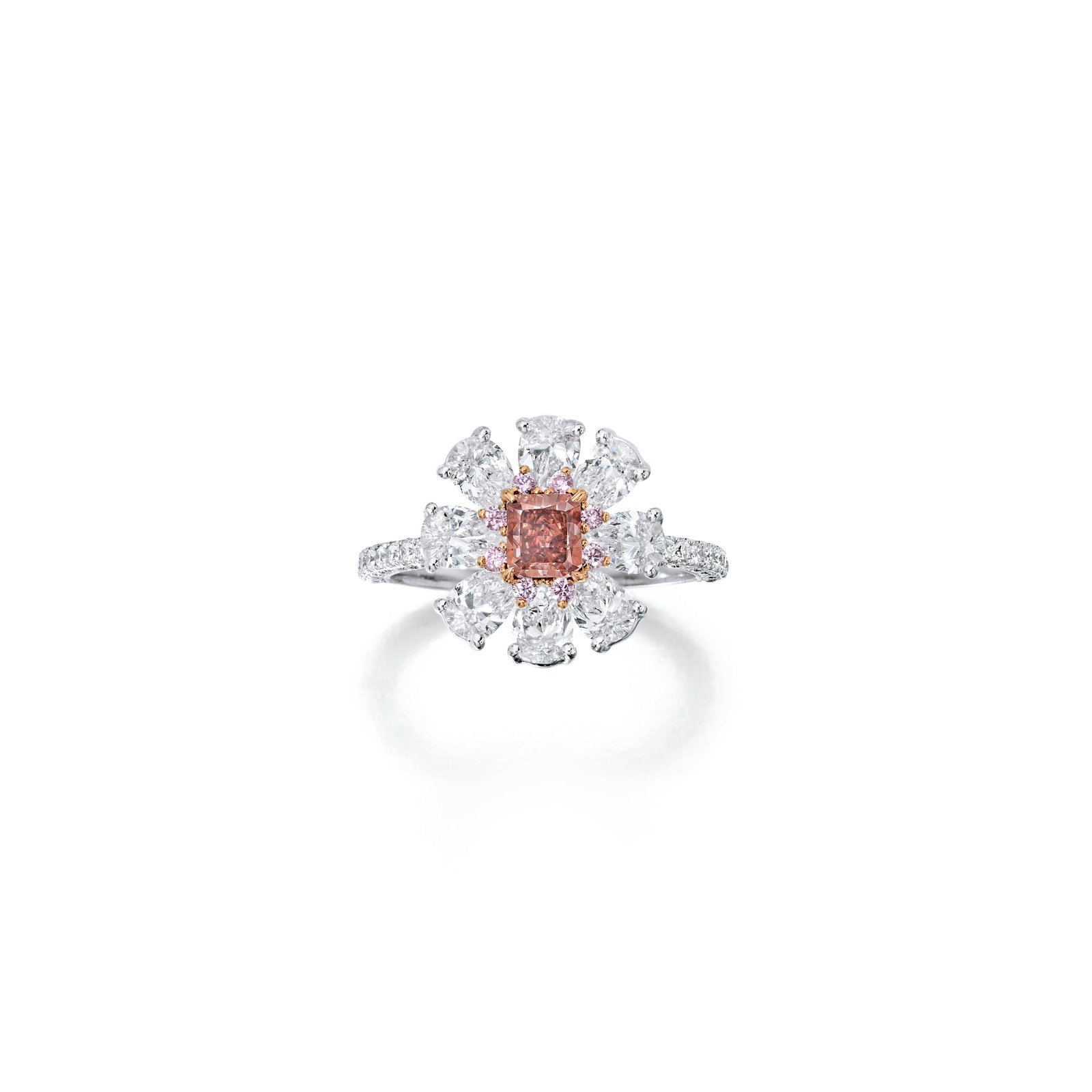 A FANCY RED DIAMOND AND DIAMOND RING: A FANCY RED DIAMOND AND DIAMOND RING Centering a radiant-cut Fancy Red diamond, weighing 0.53 carats, within a surround of pear-shaped and round brilliant-cut diamonds and diamonds with pink tint; est