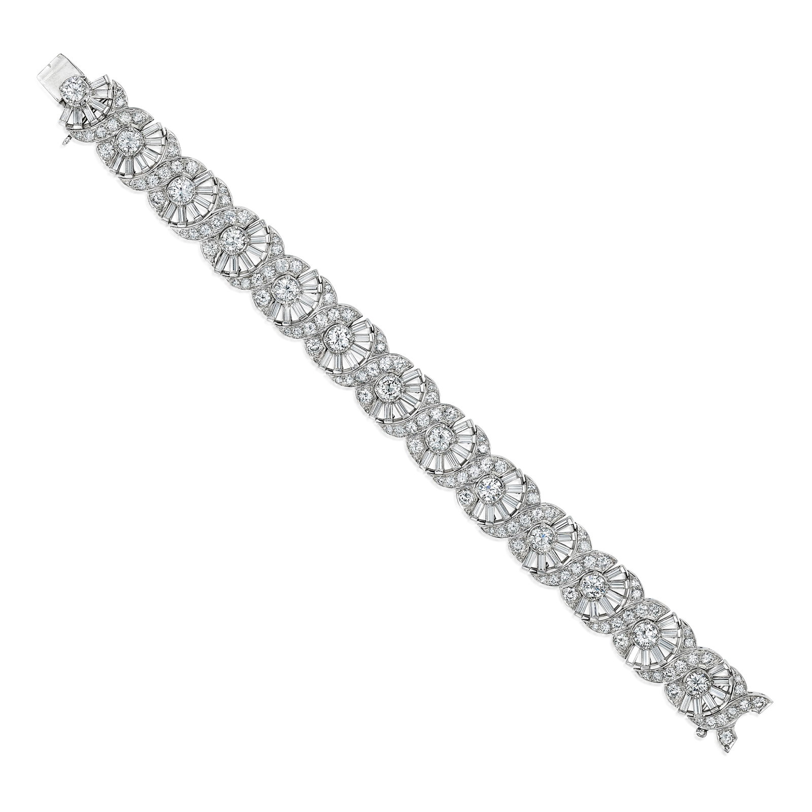 A DIAMOND BRACELET, CIRCA 1955: A DIAMOND BRACELET, CIRCA 1955 Composed of alternating half sunburst and 'X' motifs, set with round brilliant, single and baguette-cut diamonds; estimated total diamond weight 9.75 carats; mounted in