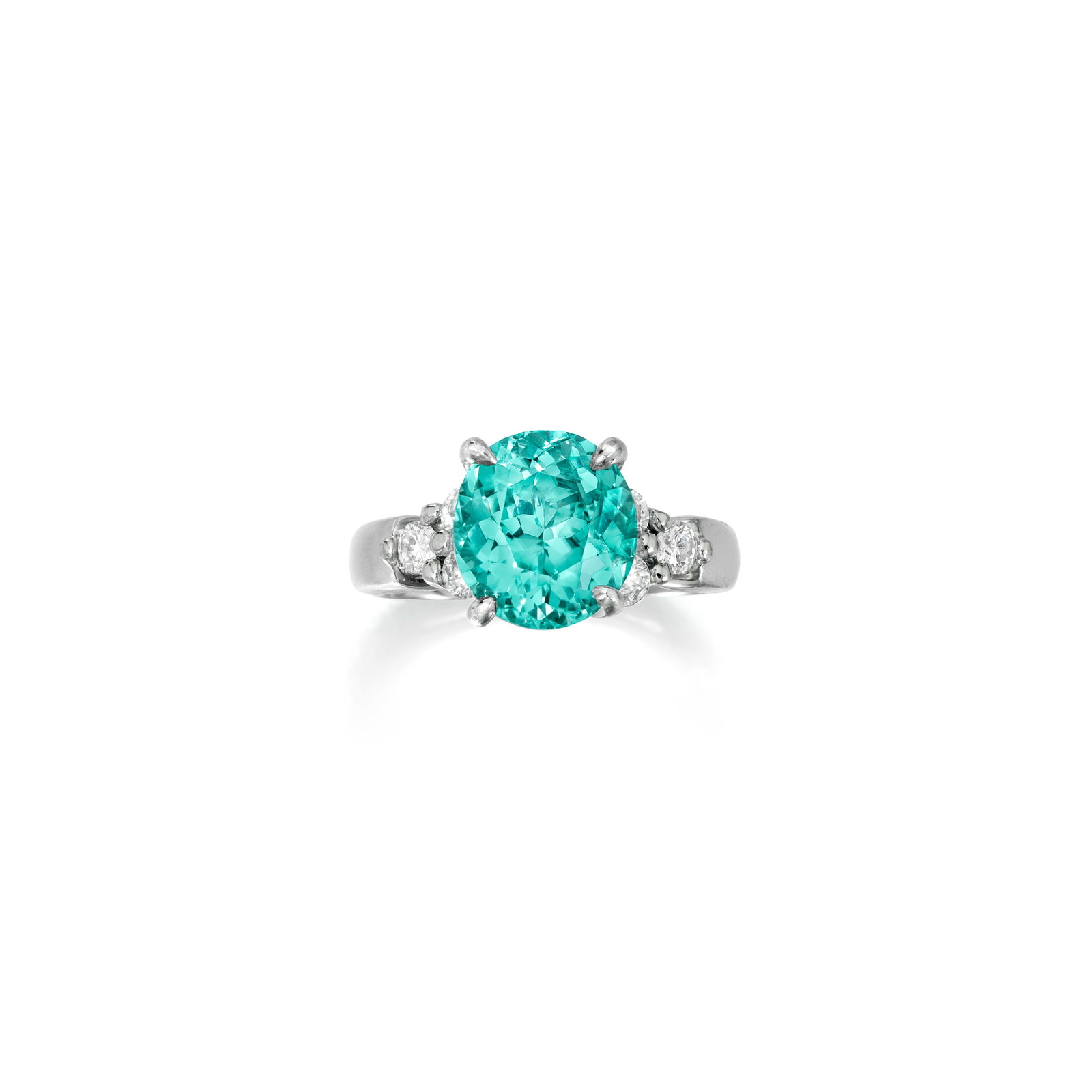 A PARAÍBA-TYPE TOURMALINE AND DIAMOND RING: A PARAÍBA-TYPE TOURMALINE AND DIAMOND RING Centering an oval-shaped Paraíba-type tourmaline, flanked by trios of round brilliant-cut diamonds; estimated tourmaline weight 3.70 carats;