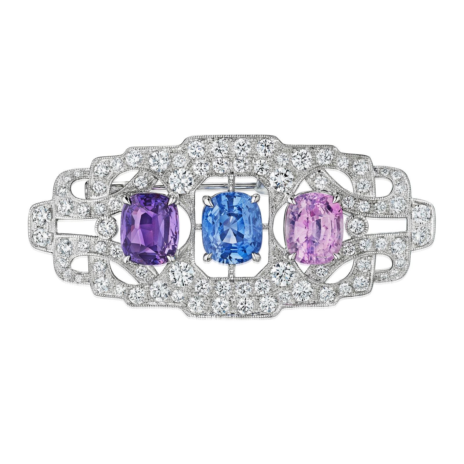 A MULTICOLORED SAPPHIRE AND DIAMOND BROOCH: A MULTICOLORED SAPPHIRE AND DIAMOND BROOCH Centering a cushion-cut sapphire weighing 5.53 carats, a cushion-cut pink sapphire 4.83 carats, and a cushion-cut purple sapphire 4.01 carats, within a