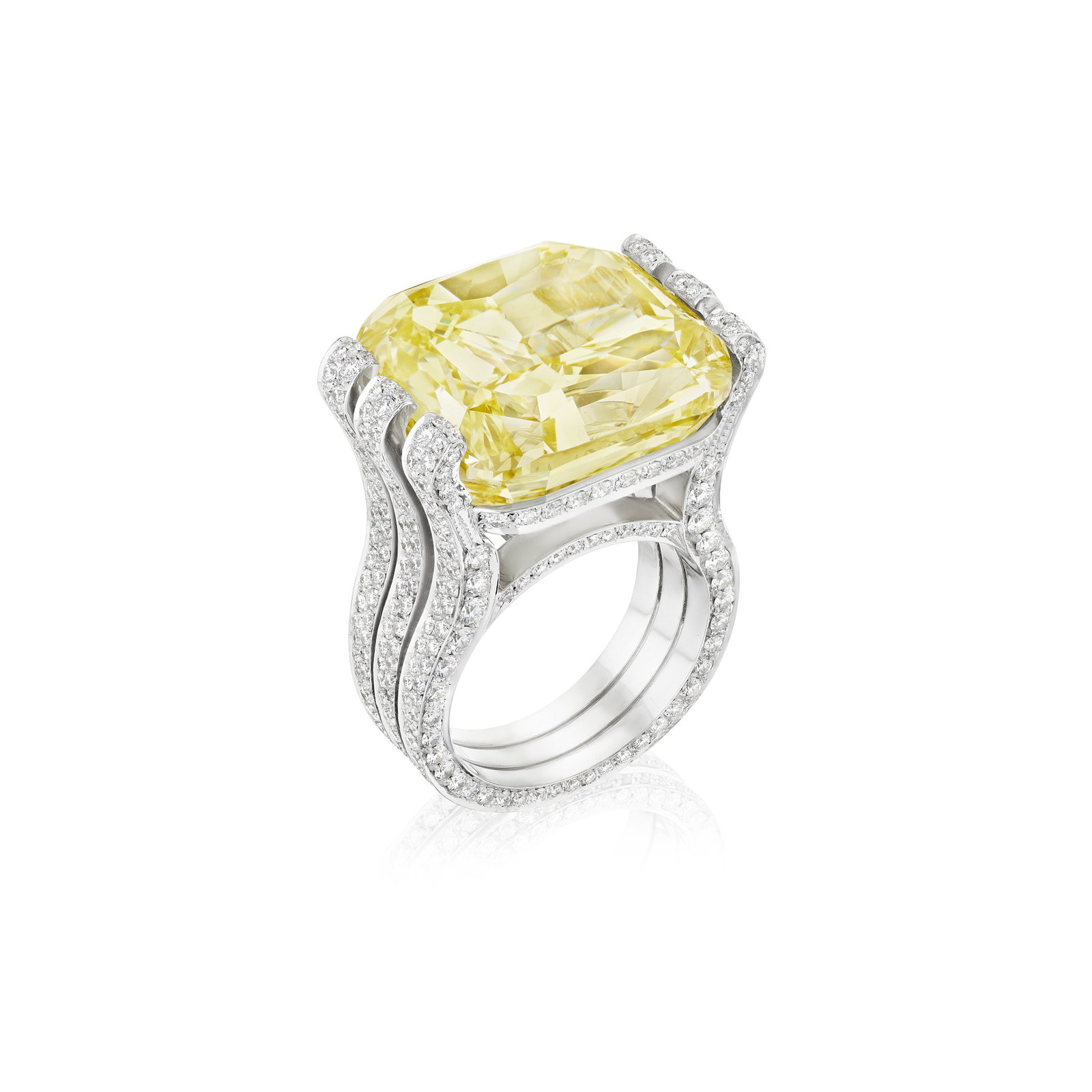 A FANCY INTENSE YELLOW DIAMOND AND DIAMOND RING: A FANCY INTENSE YELLOW DIAMOND AND DIAMOND RING Centering a cushion-cut Fancy Intense Yellow diamond, weighing 30.20 carats, within a round brilliant-cut diamond-set mount; the mount compromised,