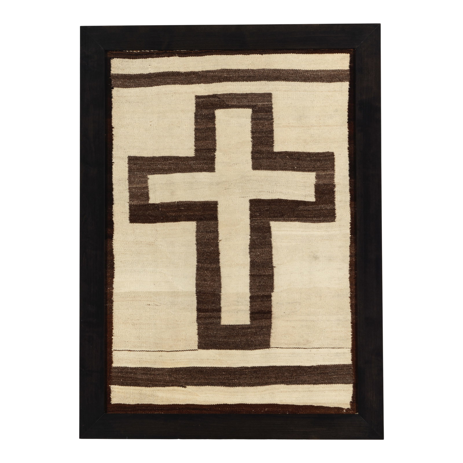A DINÉ (NAVAJO) CROSS PICTORIAL WEAVING: A DINÉ (NAVAJO) CROSS PICTORIAL WEAVING Worked with a variegated brown cross on cream ground, framed. sight 49 1/2 x 34in; framed 56 1/4 x 41in Footnotes: From Diane Keaton's hallway in her
