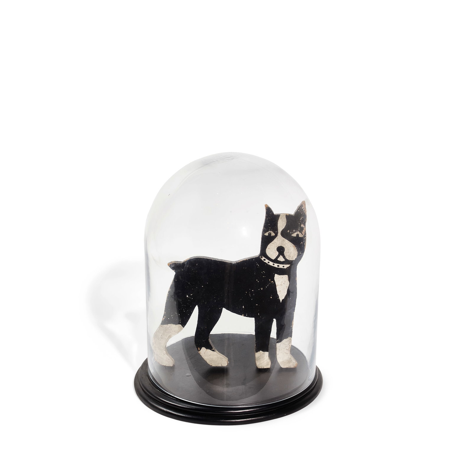 A PAINTED WOOD DOG IN GLASS DOME20th century: A PAINTED WOOD DOG IN GLASS DOME 20th century overall height approximately 17in Footnotes: From Diane Keaton's bedroom in her Sullivan Canyon home. This lot is subject to the following lot symbols: