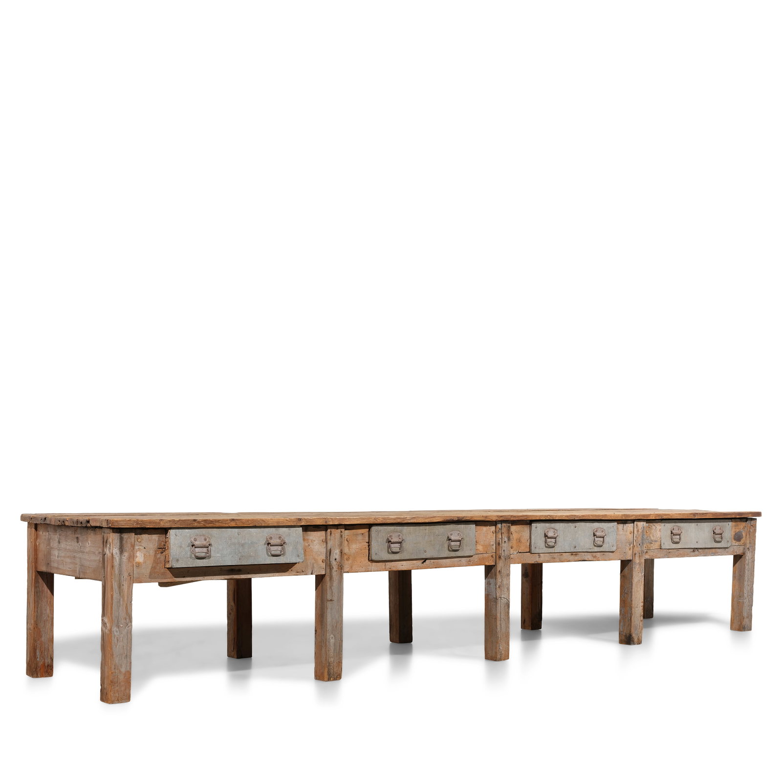 AN INDUSTRIAL METAL MOUNTED WEATHERED WOOD WORK TABLE: AN INDUSTRIAL METAL MOUNTED WEATHERED WOOD WORK TABLE height 30 1/4in; width 176in; depth 38 1/2in Footnotes: From Diane Keaton's living room in her Sullivan Canyon home. This lot is subject to the fo