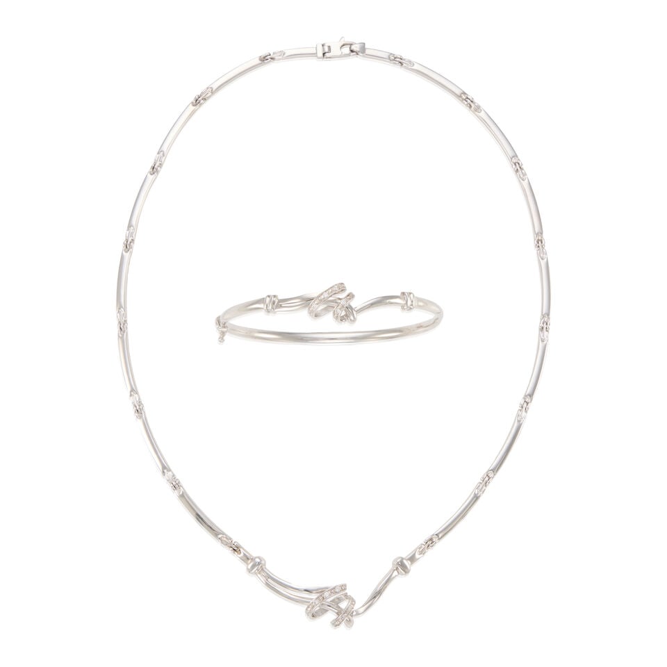 GOLD AND DIAMOND NECKLACE AND BRACELET: GOLD AND DIAMOND NECKLACE AND BRACELET • One 14K white gold bangle with five round brilliant cut diamonds weighing approximately 0.05 carat total, inner circumference 7 in. • One 16K white