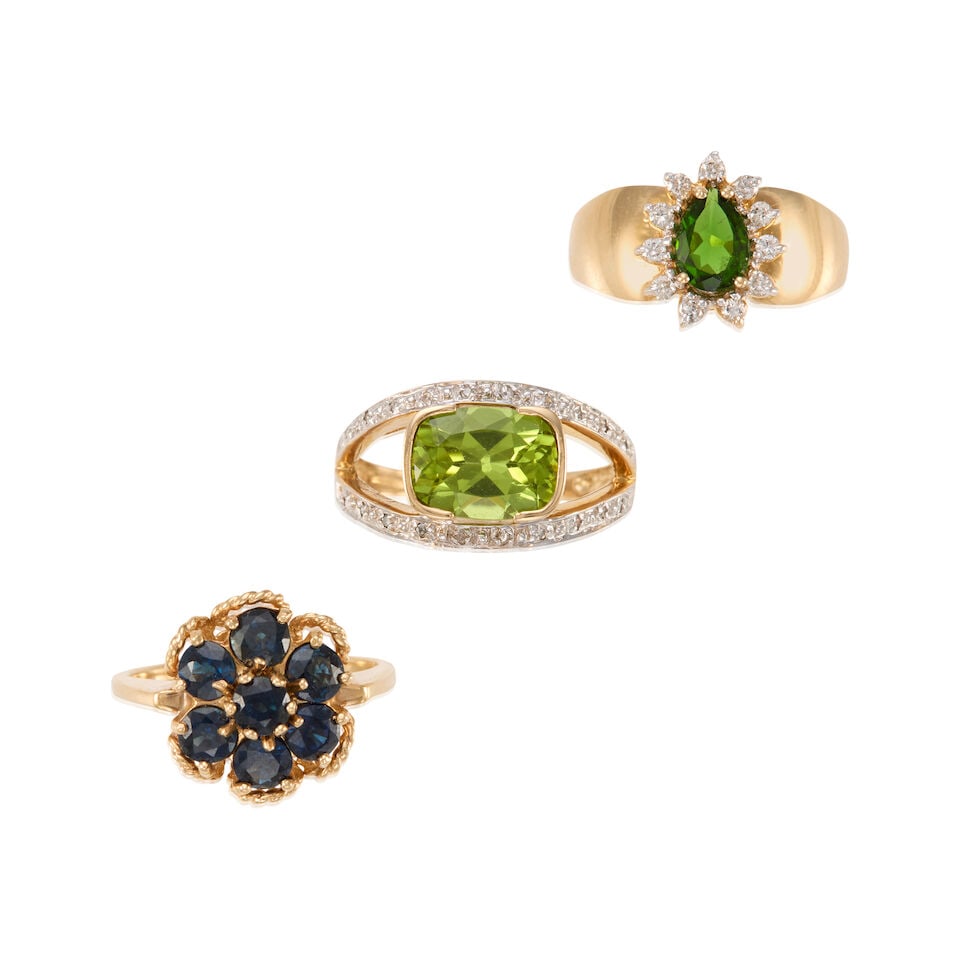 14K GOLD AND GEMSET RINGS: 14K GOLD AND GEMSET RINGS • One 14K yellow gold ring with a rectangular shaped peridot weighing approximately 2.70 carat, with numerous round shaped diamonds, size 6 3/4 • One 14K yellow