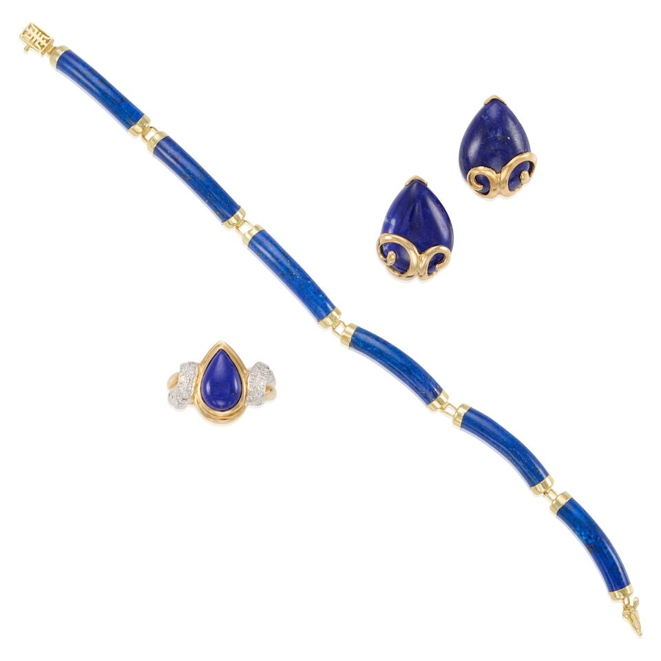 14K GOLD, LAPIS LAZULI, AND DIAMOND SUITE: 14K GOLD, LAPIS LAZULI, AND DIAMOND SUITE • One 14K yellow gold bracelet with six carved lapis lazuli pieces, length 6 1/2 in. • Pair of 14K yellow gold earrings with two pear shaped