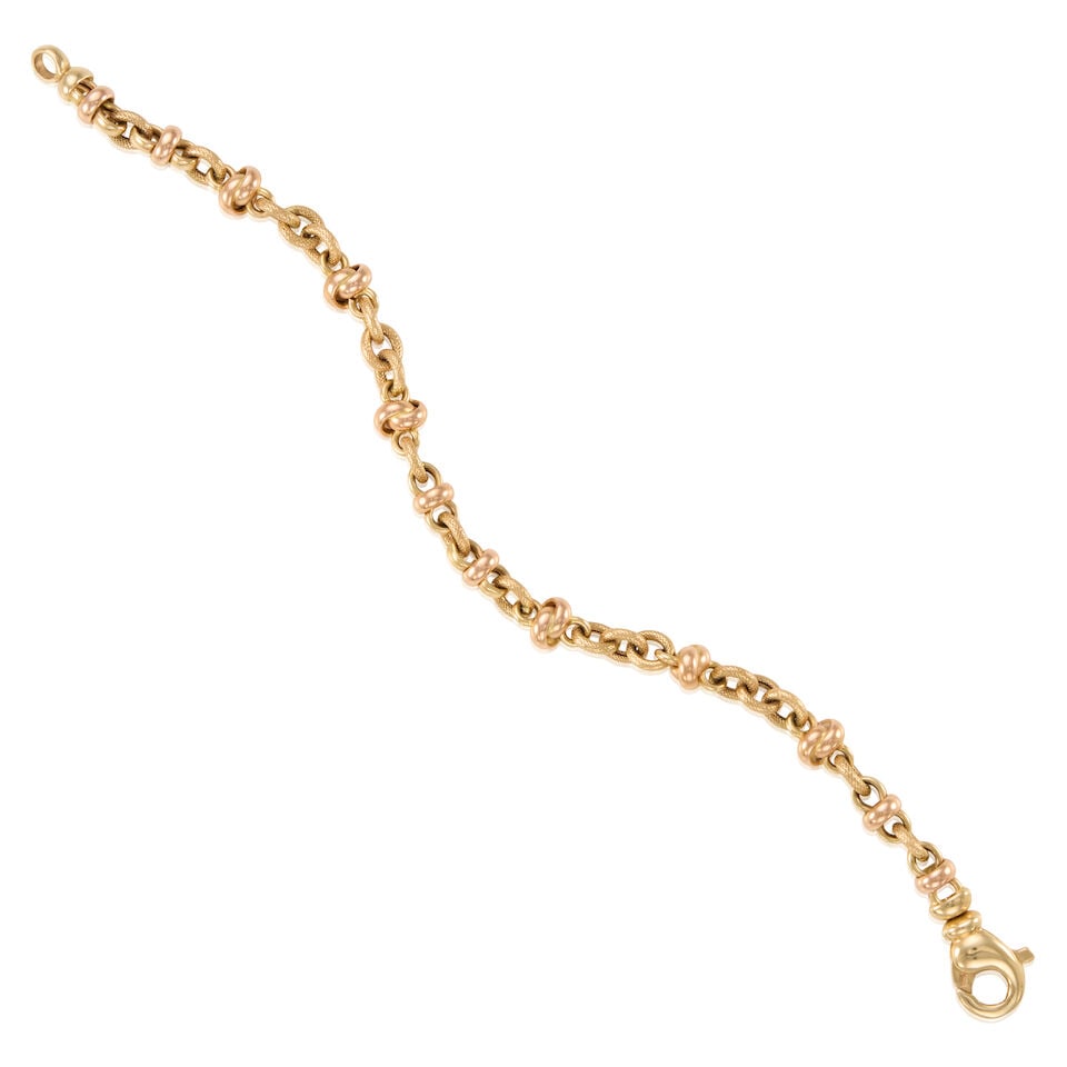 14K GOLD BRACELET: 14K GOLD BRACELET • 14K yellow and rose gold • Length 7 1/4 in. • Estimated gross weight: 12.5 grams Footnotes: Overall condition, very good Metal stamped and tested for 14K