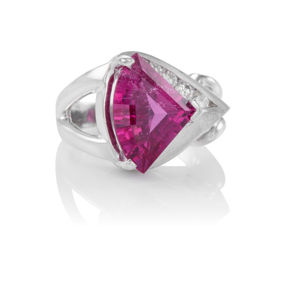 PLATINUM, TOURMALINE, AND DIAMOND RING: PLATINUM, TOURMALINE, AND DIAMOND RING • Platinum • One triangular shaped tourmaline measuring approximately 11.19mm x 16.24mm x 6.01mm • Five round brilliant cut diamonds weighing