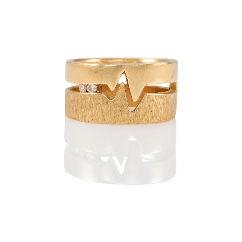 14K GOLD AND DIAMOND RING: 14K GOLD AND DIAMOND RING • 14K yellow gold • Two round brilliant diamonds weighing approximately 0.04 carat total • Size 8 • Estimated gross weight: 9.8