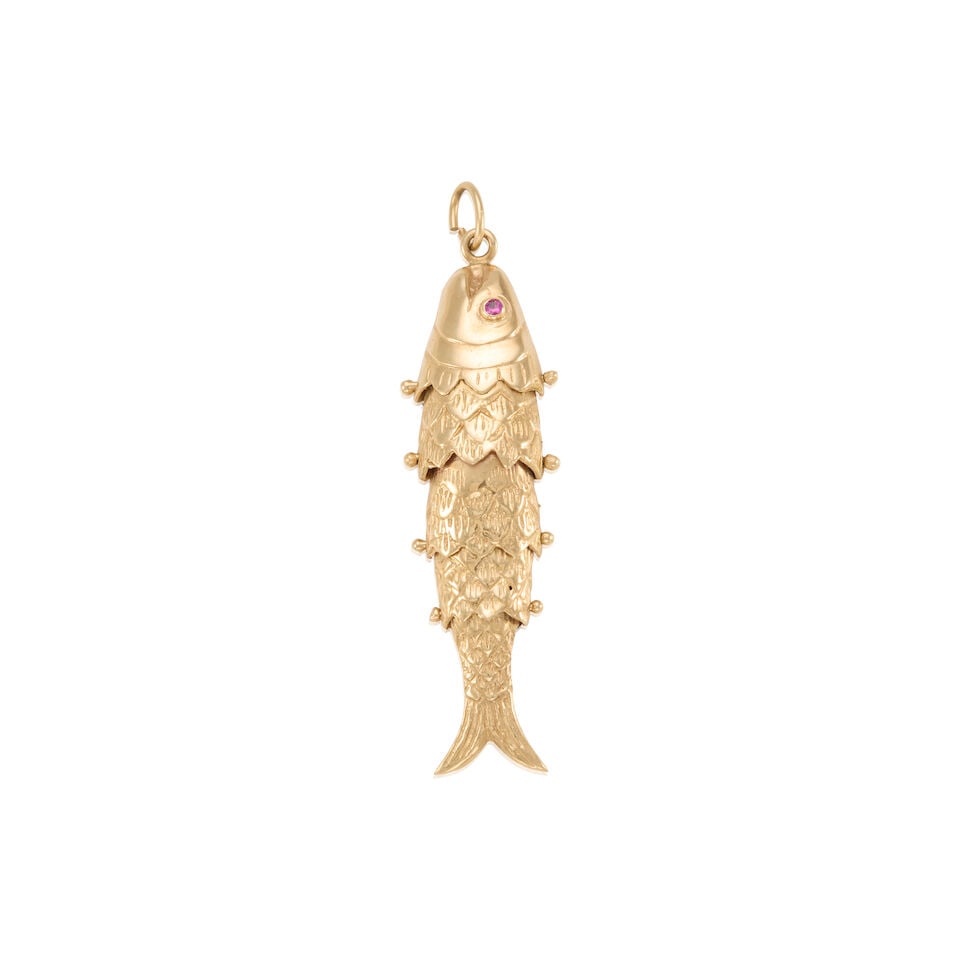 14K GOLD PENDANT: 14K GOLD PENDANT • 14K yellow gold • Designed as an articulated fish pendant • Two round shaped rubies • Measures 1 3/4 in. x 1/2 in. • Estimated gross weight: 6.1