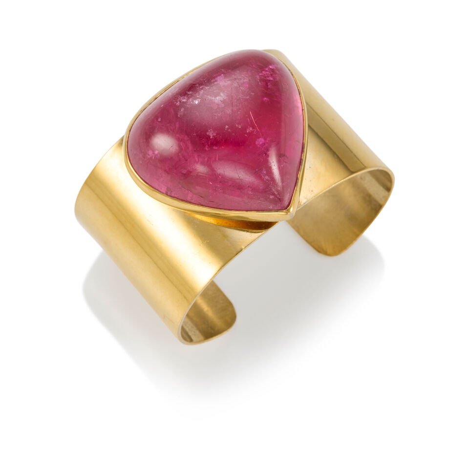 TOURMALINE CUFF BRACELET: TOURMALINE CUFF BRACELET • Gold-plated sterling silver • 1 cabochon tourmaline measuring approximately 40.0 x 45.0 x 17.9mm • Maker's mark • Inner circumference 6 1/4 in., gam