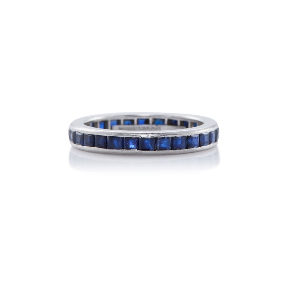 TIFFANY & CO.: PLATINUM AND SAPPHIRE RING: TIFFANY & CO.: PLATINUM AND SAPPHIRE RING • Platinum • Numerous square shaped sapphires measuring approximately 1.40 carats total • Signed TIFFANY & CO • Size 5 3/4 •